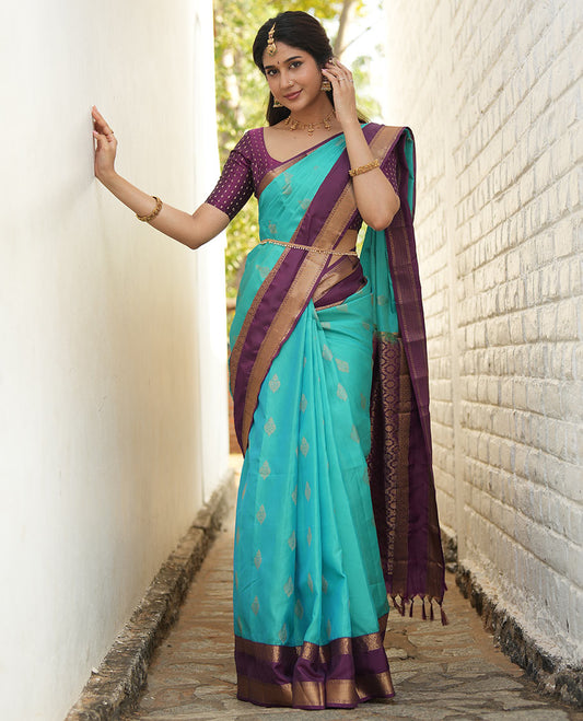 Blue zari buttas woven silk saree, contrast rettai pettu border of laddu kamalam designs, and jaal pallu