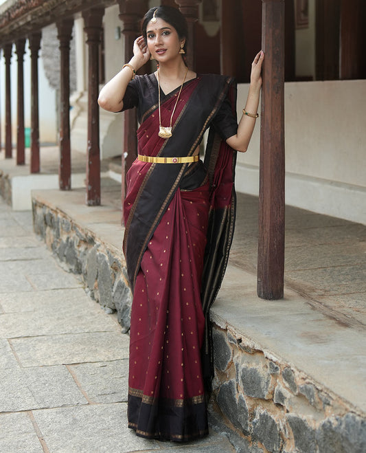 Maroon Poun Buttas Vasundhara Silk Saree, Contrast Rettai Pettu Border of Rekku, Neli, and Rudraksham Designs, and Zari-Rich Intricate Pallu