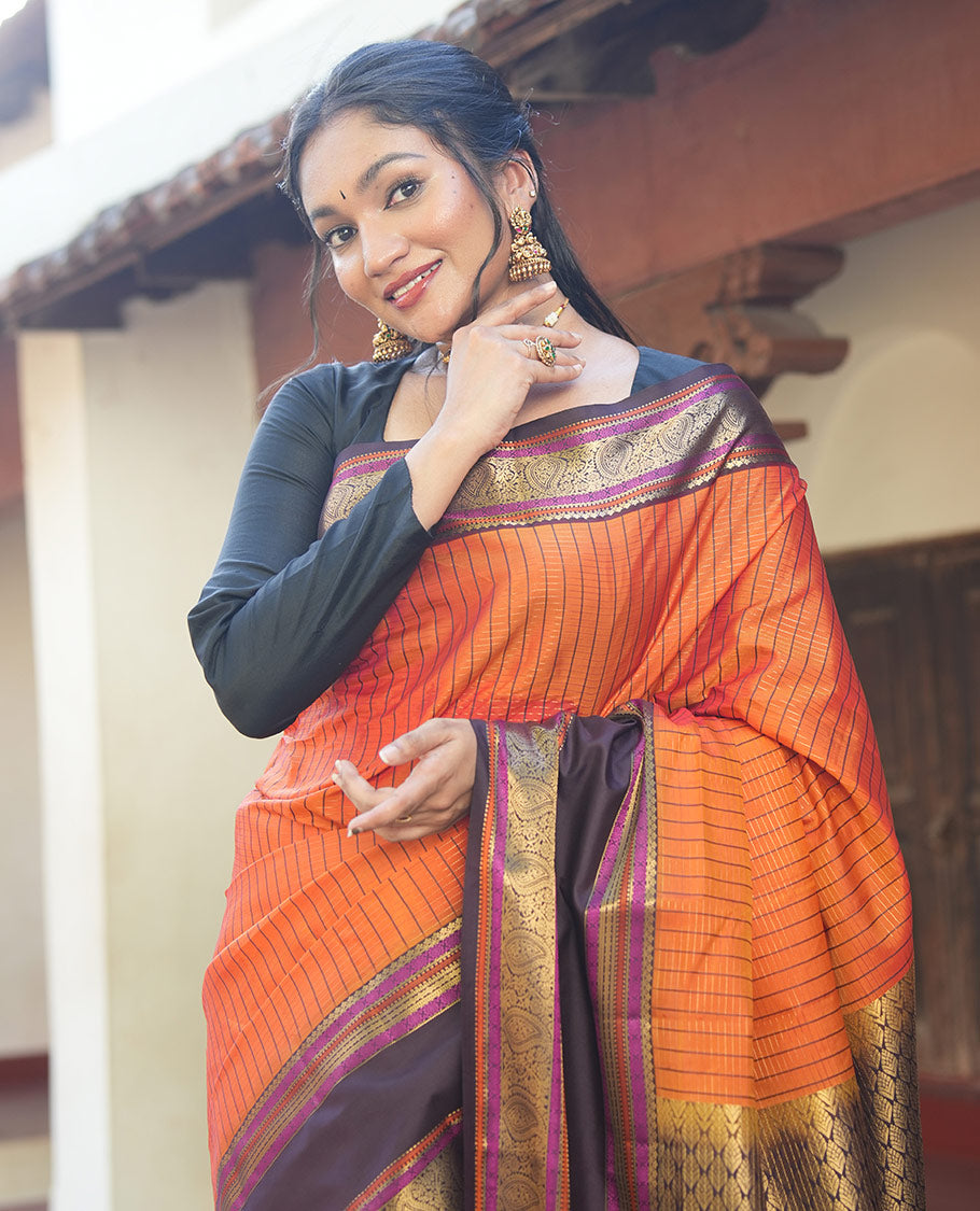 Orange Vasundhara Lite Silk Saree, Subtly Detailed with Stripes, Complemented by a Contrast Rettai Pettu Border of Salngai, Cross Kamalam, Muthu, Kathir, Diamond, and Arumbu Manga Designs, Grand Jaal Pallu, and Paired with a Contrast Blouse
