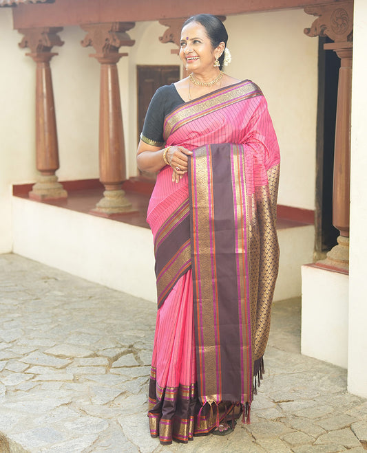 Pink Vasundhara Lite Silk Saree, Subtly Detailed with Thread and Zari Stripes, Complemented by Contrast Rettai Pettu Border of Salngai, Cross Kamalam, Muthu, Kathir, Diamond, and Arumbu Manga Designs, Grand Jaal Pallu, and Paired with a Contrast Blouse