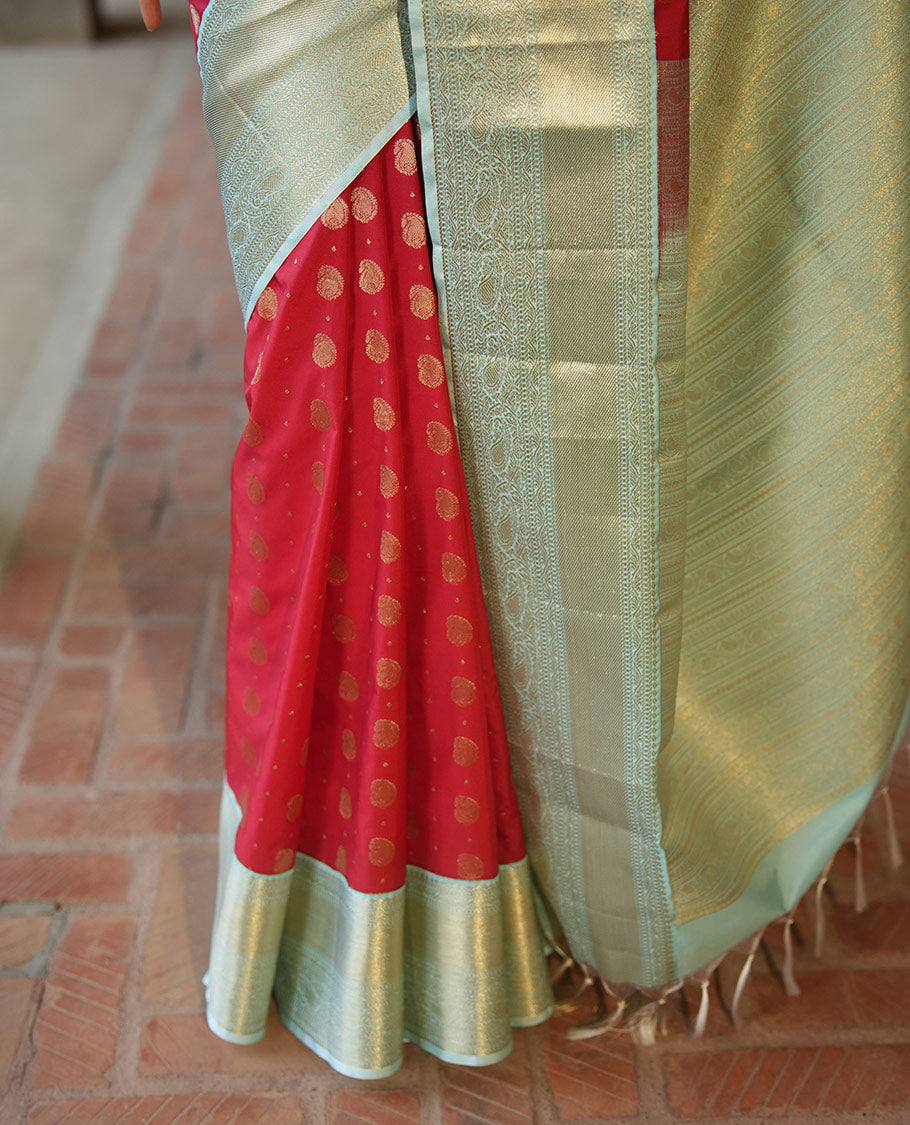 Red BudgetSilk Saree, Spotlighted with Zari Buttas All Over Its Body, Complemented by a Contrast Border of Banaras, Muthu, Kodi Visiry and Kodi Manga Designs, Pallu Steeped with Kodi Manga Designs, and Paired with a Contrast Blouse