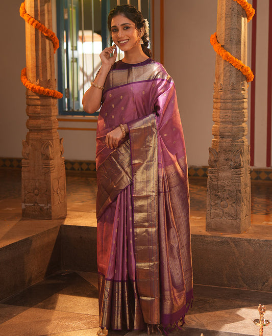 Pink Vasundhara Silk Saree, Elevated with Zari Stripes and Chakram Buttas All Over Its Body, Complemented by a Contrast Border of Rekku, Muthu, Kamalam and Mayil Kann Designs, Grand Geometric Patterned Pallu, and Paired with a Contrast Blouse