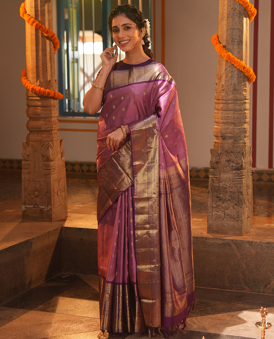 Pink Vasundhara Silk Saree, Elevated with Zari Stripes and Chakram Buttas All Over Its Body, Complemented by a Contrast Border of Rekku, Muthu, Kamalam and Mayil Kann Designs, Grand Geometric Patterned Pallu, and Paired with a Contrast Blouse