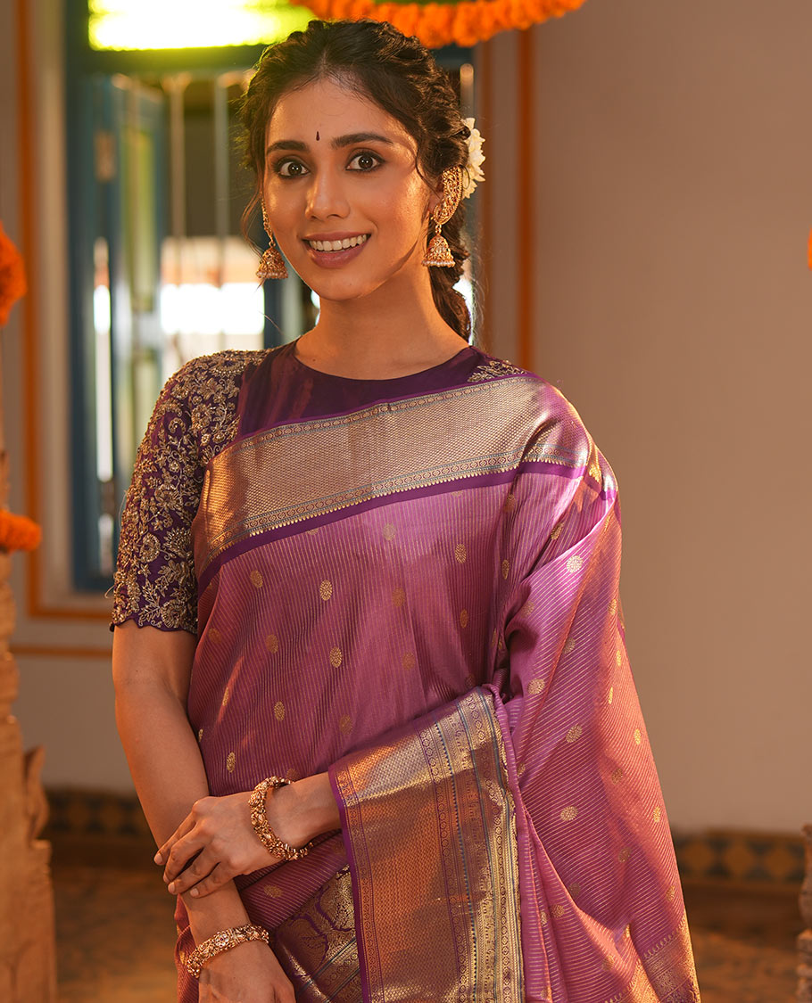 Pink Vasundhara Silk Saree, Elevated with Zari Stripes and Chakram Buttas All Over Its Body, Complemented by a Contrast Border of Rekku, Muthu, Kamalam and Mayil Kann Designs, Grand Geometric Patterned Pallu, and Paired with a Contrast Blouse