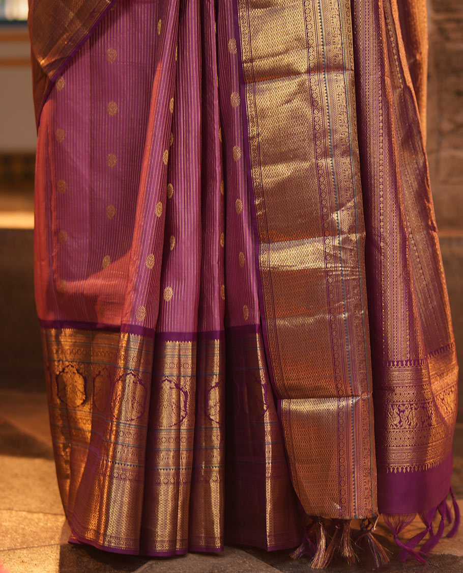 Pink Vasundhara Silk Saree, Elevated with Zari Stripes and Chakram Buttas All Over Its Body, Complemented by a Contrast Border of Rekku, Muthu, Kamalam and Mayil Kann Designs, Grand Geometric Patterned Pallu, and Paired with a Contrast Blouse