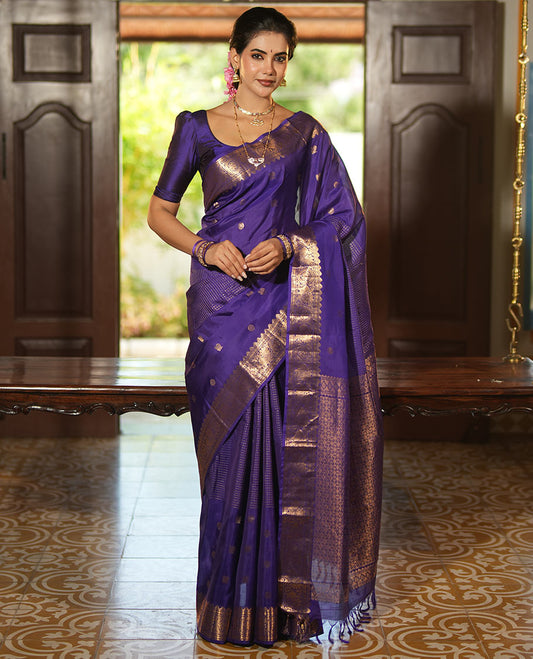 Violet Vasundhara Lite Silk Mix Saree, Artfully Detailed with Mayil-Chakram Buttas and Zari Checks All Over Its Body, Highlighted by a Zari Border of Thazampoo Rekkum, Paisa, Mayil, and Chakram Designs, a Grand Pallu, and Paired with a Matching Blouse