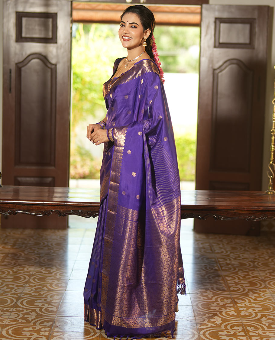 Violet Vasundhara Lite Silk Mix Saree, Artfully Detailed with Mayil-Chakram Buttas and Zari Checks All Over Its Body, Highlighted by a Zari Border of Thazampoo Rekkum, Paisa, Mayil, and Chakram Designs, a Grand Pallu, and Paired with a Matching Blouse