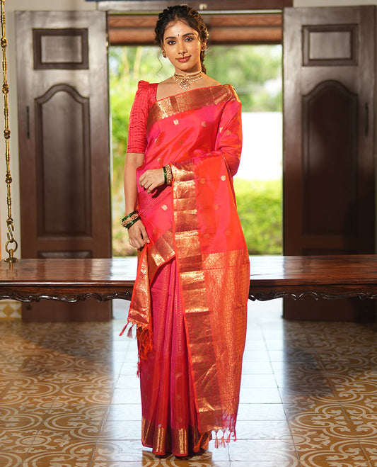 Pink Vasundhara Lite Silk Mix Saree, Artfully Detailed with Mayil-Chakram Buttas and Zari Checks All Over Its Body, Highlighted by a Zari Border of Thazampoo Rekkum, Paisa, Mayil, and Chakram Designs, a Grand Pallu, and Paired with a Matching Blouse