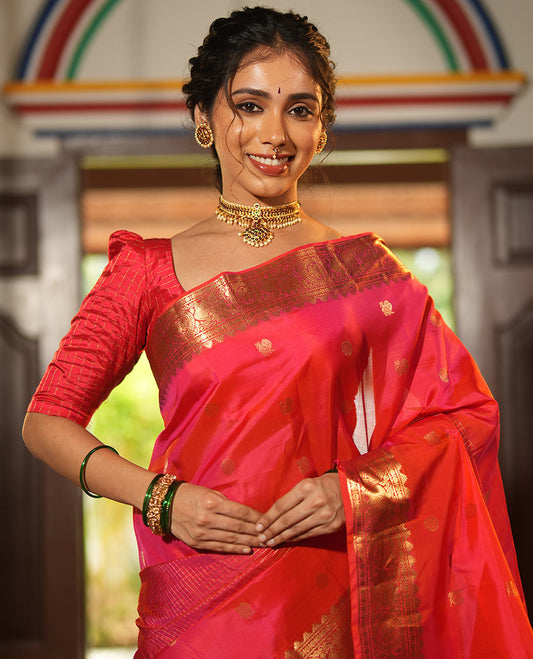 Pink Vasundhara Lite Silk Mix Saree, Artfully Detailed with Mayil-Chakram Buttas and Zari Checks All Over Its Body, Highlighted by a Zari Border of Thazampoo Rekkum, Paisa, Mayil, and Chakram Designs, a Grand Pallu, and Paired with a Matching Blouse