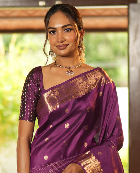 Purple Vasundhara Lite Silk Mix Saree, Artfully Detailed with Mayil-Chakram Buttas and Zari Checks All Over Its Body, Highlighted by a Zari Border of Thazampoo Rekkum, Paisa, Mayil, and Chakram Designs, a Grand Pallu, and Paired with a Matching Blouse