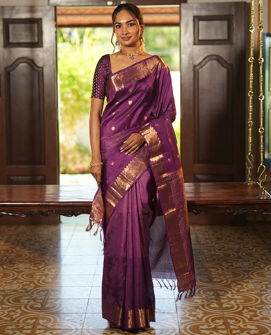 Purple Vasundhara Lite Silk Mix Saree, Artfully Detailed with Mayil-Chakram Buttas and Zari Checks All Over Its Body, Highlighted by a Zari Border of Thazampoo Rekkum, Paisa, Mayil, and Chakram Designs, a Grand Pallu, and Paired with a Matching Blouse
