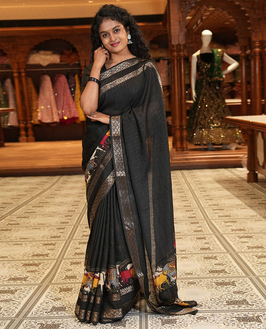 Black Dola Silk Saree Features Vertical Stripes and Pichwai Cow Motifs, Adorned with a Pallu Steeped in Pichwai Cow Motifs, and Paired with a Matching Blouse of Pichwai Lotus Motifs