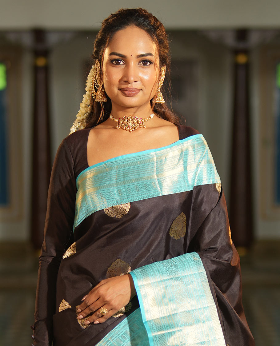 Brown Vasundhara Silk Saree, Spotlighted with Zari Buttas All Over Its Body, Complemented by a Contrast Border of Kodi Visiry Designs, a Grand Pallu, and Paired with a Contrast Blouse
