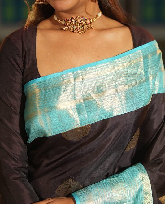 Brown Vasundhara Silk Saree, Spotlighted with Zari Buttas All Over Its Body, Complemented by a Contrast Border of Kodi Visiry Designs, a Grand Pallu, and Paired with a Contrast Blouse