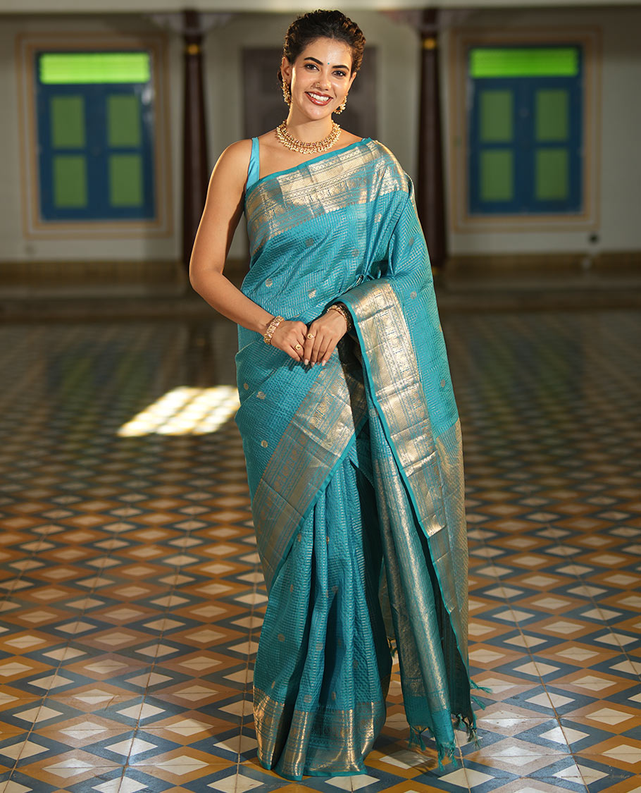 Blue Vasundhara Lite Silk Mix Saree, Richly Detailed with Zari Buttas and Zari Checks All Over Its Body, Highlighted by a Zari Border of Manga, Neli, Kamalam, Mayil, and Vanki Designs, Gleaming Intricately Designed Pallu, and Paired with a Matching Blouse