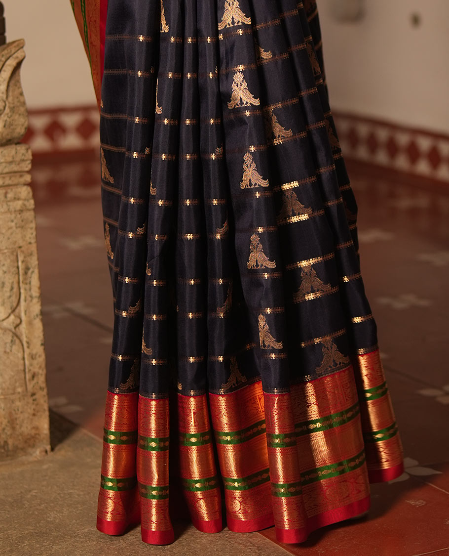 Blue Vasundhara Silk Saree, Accentuated with Zari Buttas and Stripes All Over Its Body, Complemented by a Contrast Border of Elephant, Mayil, and Chakram Designs, a Grand Pallu, and Paired with a Contrast Blouse
