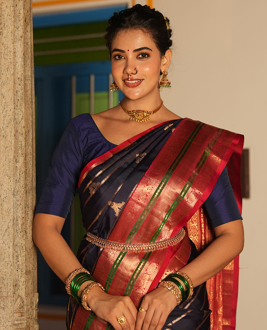 Blue Vasundhara Silk Saree, Accentuated with Zari Buttas and Stripes All Over Its Body, Complemented by a Contrast Border of Elephant, Mayil, and Chakram Designs, a Grand Pallu, and Paired with a Contrast Blouse