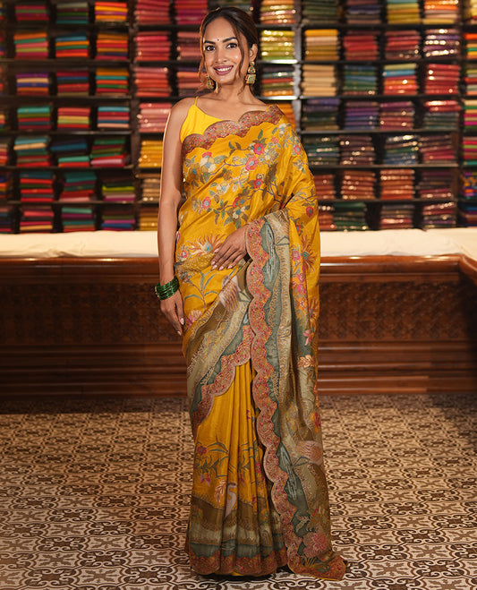 Yellow Dola Silk Saree, Beautified with Meenakari-Style Flora-Fauna Motifs Printed on Its Body, Scallop Kaleidoscope-Colored Printed Border, Pallu of the Same Print, and Paired with a Matching Blouse