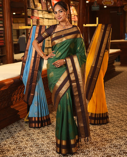 Green Budget Silk Saree, Delicately Woven with Zari Stripes and Kolam Buttas All Over Its Body, Complemented by a Contrast Traditional Zari Design Rettai Pettu Border, Grand Scallop Design Pallu, and Paired with a Contrast Blouse