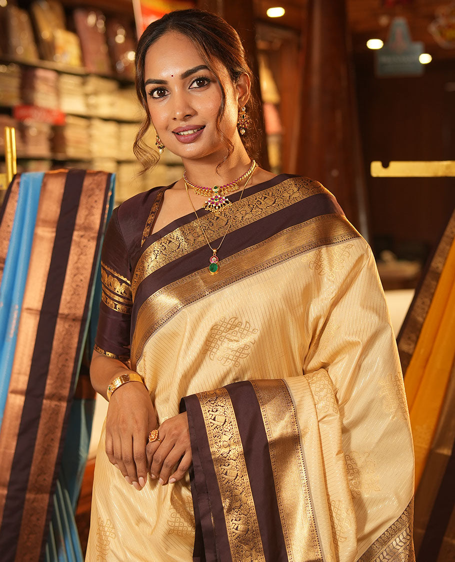 Sandal Budget Silk Saree, Embellished with Zari Stripes and Kolam Buttas All Over Its Body, Complemented by a Contrast Traditional Zari Design Rettai Pettu Border, Grand Scallop Design Pallu, and Paired with a Contrast Blouse