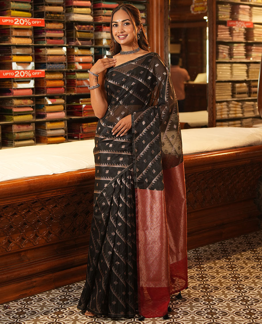 Borderless Black Chanderi Cotton Saree, Adorned with Zari Buttas and Temple Stripes on Its Body, Complemented by Contrast Pallu of Jaal Designs, and Paired with a Contrast Jacquard Blouse