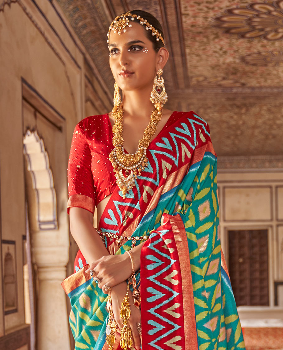 Persian green ikkat style fancy tussar designer catalog saree, contrast chevron ikkat border, and ikkat design pallu