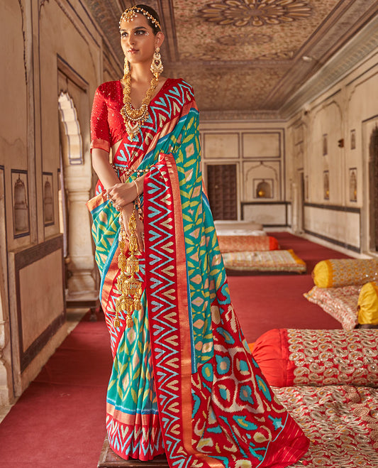 Persian green ikkat style fancy tussar designer catalog saree, contrast chevron ikkat border, and ikkat design pallu