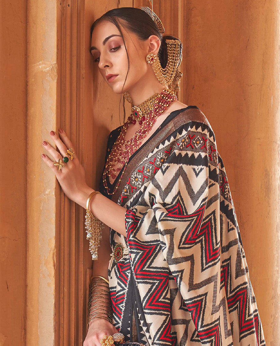 Cream and black chevron stripes printed designer saree, geometric printed border, and ikkat design pallu