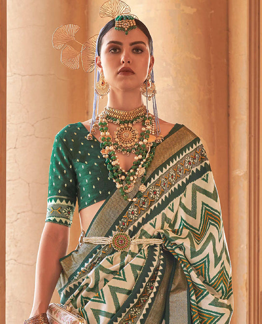 Cream and green chevron stripes printed designer saree, geometric printed border, and ikkat design pallu