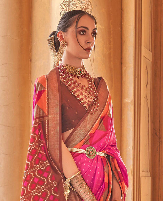 Pink ikkat buttas dsigner saree, contrast geometric patterned ikkat border, and ikat-style heart motifs printed pallu