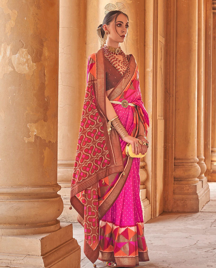 Pink ikkat buttas dsigner saree, contrast geometric patterned ikkat border, and ikat-style heart motifs printed pallu