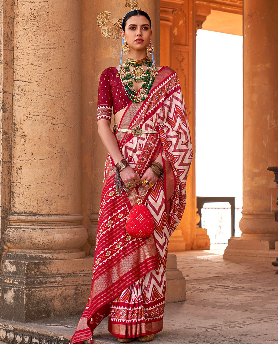 Cream and red chevron stripes printed designer saree, geometric printed border, and ikkat design pallu