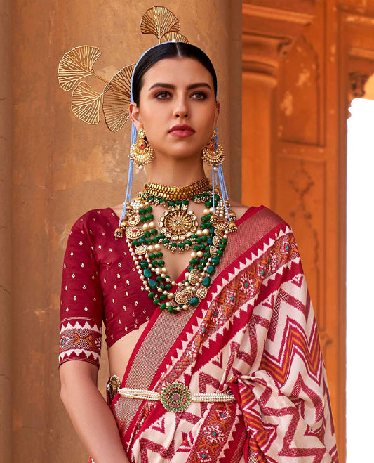 Cream and red chevron stripes printed designer saree, geometric printed border, and ikkat design pallu