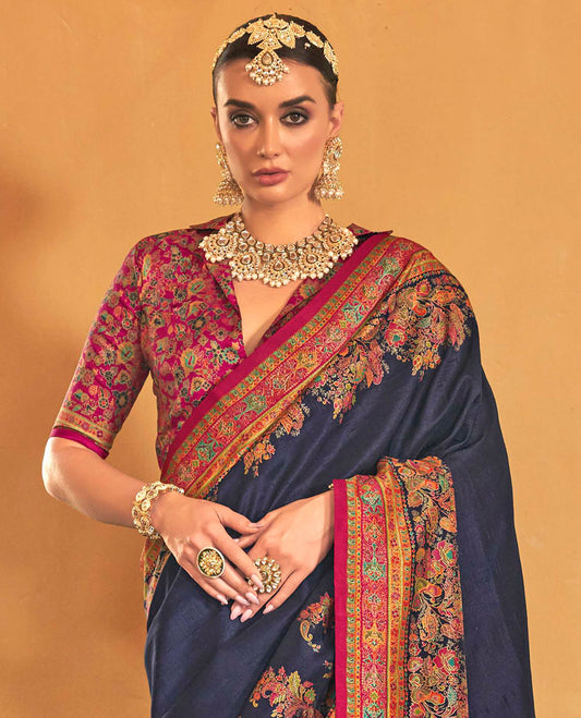 Navy blue plain with meenakari-style floral-paisleys printed designer saree, contrast floral-paisleys Mughal-style printed border, and pallu