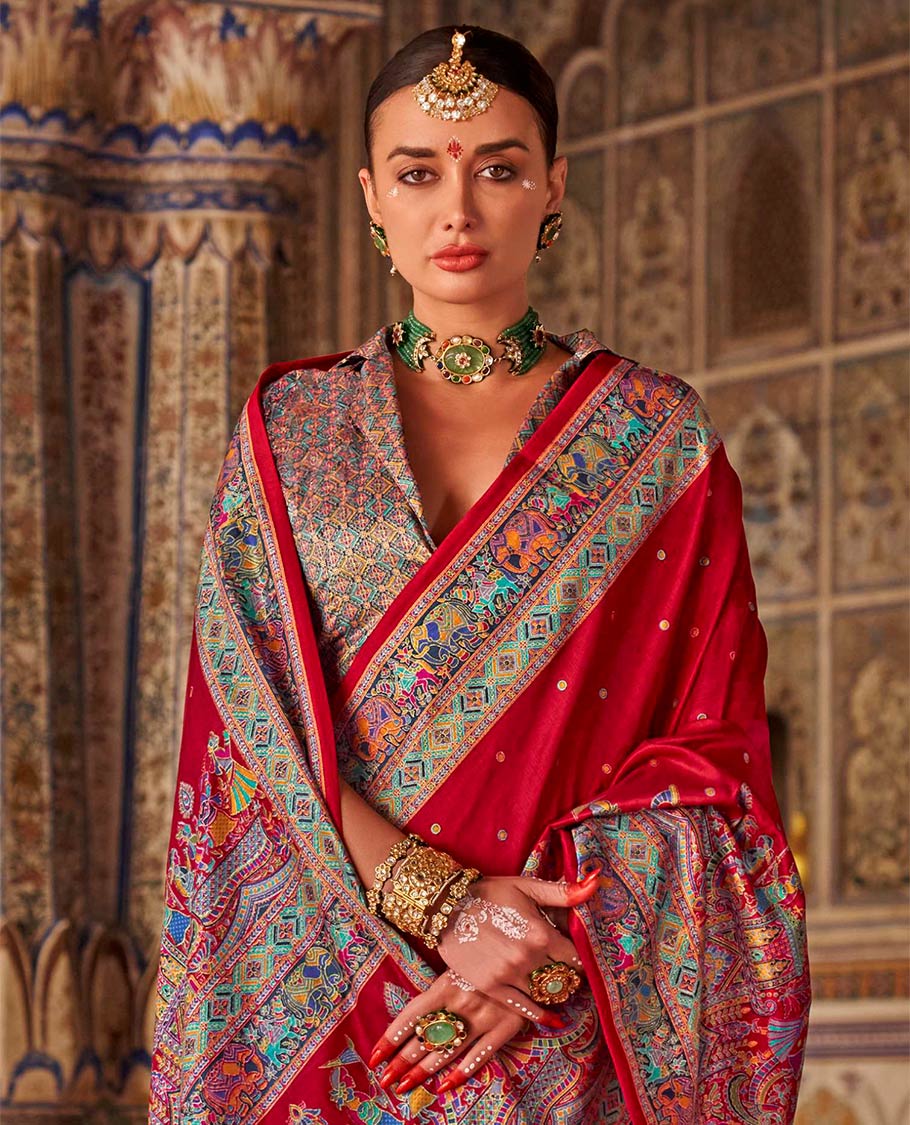 Red meena buttas designer catalog saree, contrast meenakari border of human and elephant motifs, and wedding theme meenakari pallu