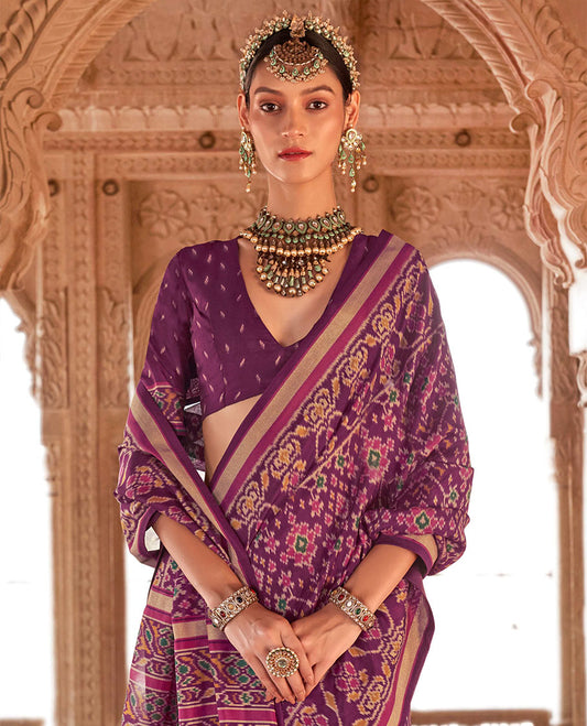 Purple Ikat Patola Designer Saree, Decked Up with Intricate Ikat Designs, Highlighted by Intricate Ikat Border, Intricate Pallu, and a Matching Blouse