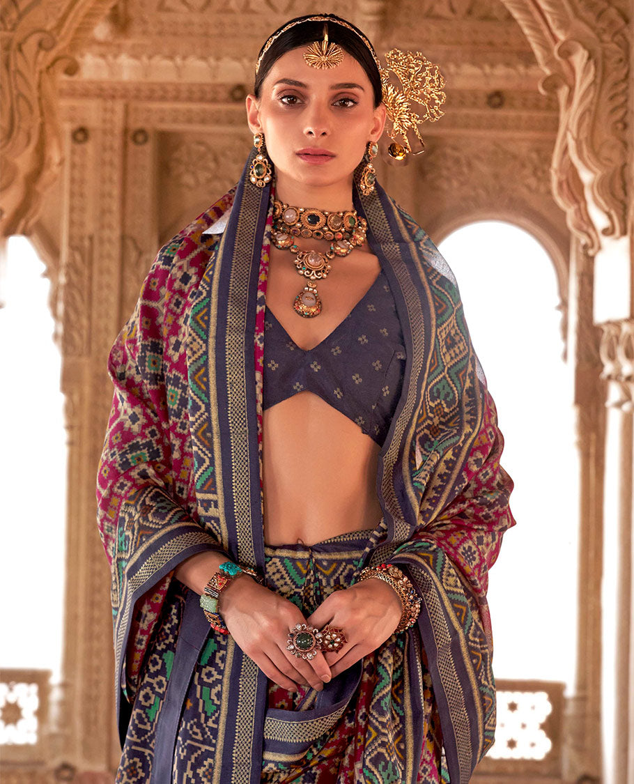 Wine Ikat Patola Designer Saree, Elevated with Intricate Ikat Designs, Complemented by a Contrast Ikat Border, Intricate Pallu, and a Contrast Blouse
