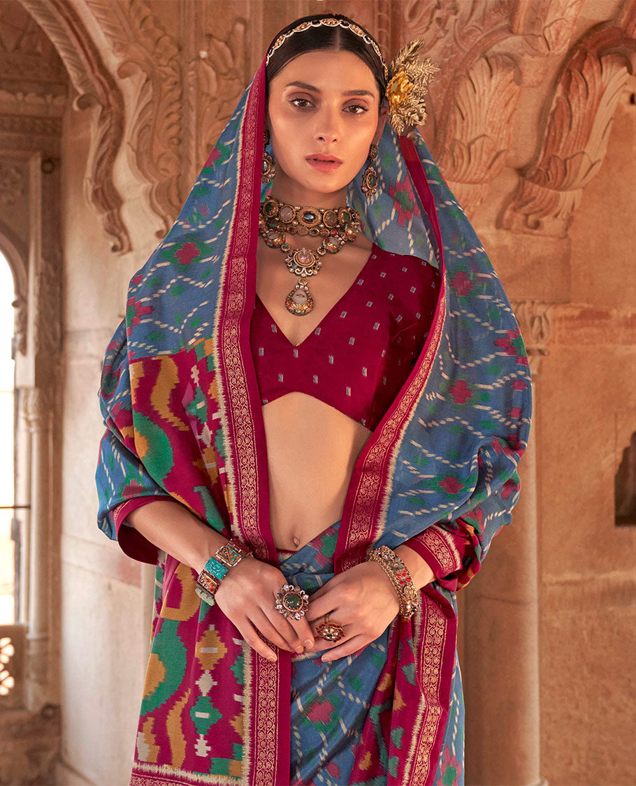 Blue Ikat Patola Designer Saree, Highlighted by Geometric Ikat Designs, Complemented by a Contrast Ikat Border, Intricate Pallu, and a Contrast Blouse