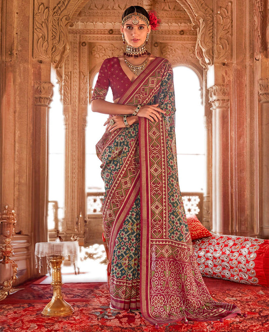 Green Ikat Patola Designer Saree, Graced with Intricate Ikat Designs, Complemented by a Contrast Ikat Border, Intricate Pallu, and a Contrast Blouse