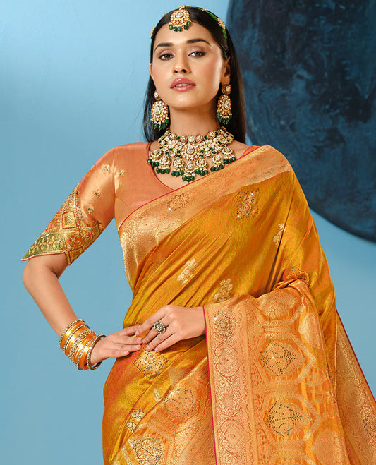 Orange Designer Saree Decked Up with Buttas and Micro-Stone Work, Featuring a Zari-Stonework Border, Intricately Embroidered Pallu, and a Contrast Embroidered Blouse