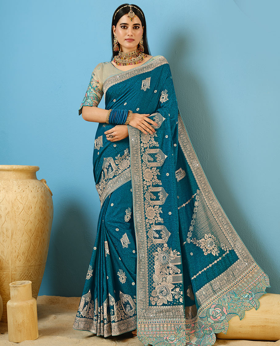 Blue Designer Saree Decorated with Buttas and Embossed Effect, Self-Border Complemented by Mughal-Inspired Motifs, Pallu of Embroidery, and a Contrast Embroidered Blouse