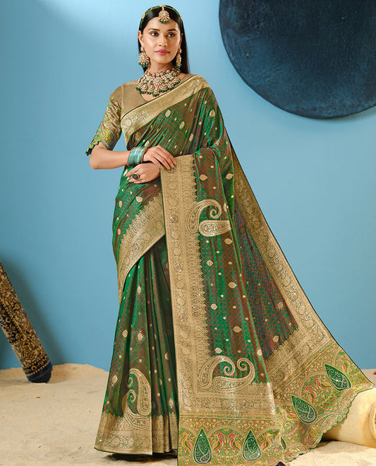 Green Designer Saree Highlighted with Buttas and Stone Work, Intricate Motifs Woven Border, and Pallu Embroidered with Flora-Fauna Motifs, Along with a Contrast Embroidery Blouse