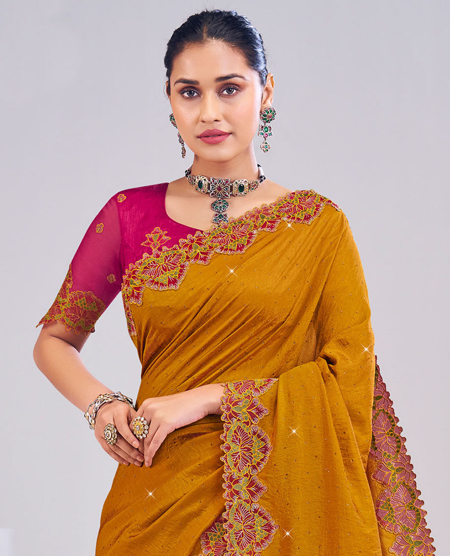Mustard designer catalog saree with micro-stones sticked all over its body, scallop floral embroidered border