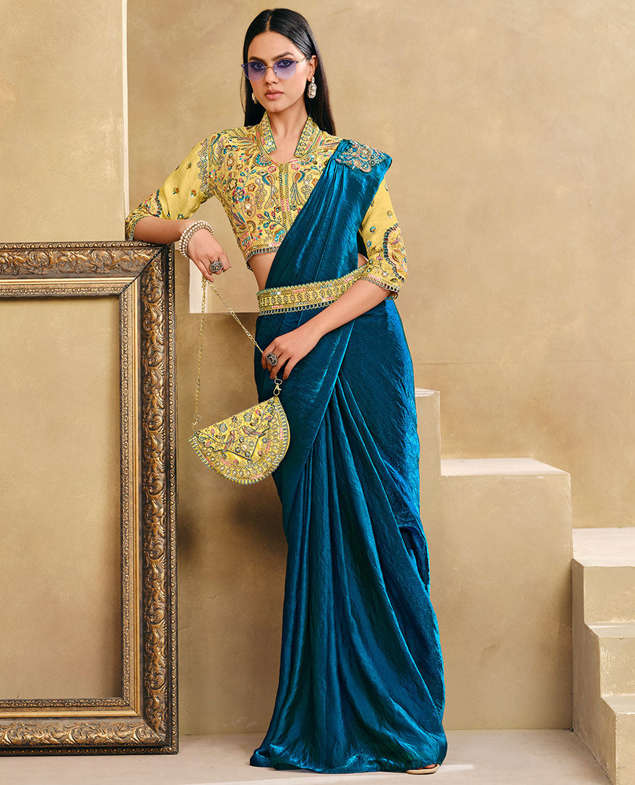 Blue Plain Party Wear Designer Saree, Complemented with a Contrast Collared Neck Heavy Embroidered 3/4th Sleeve Readymade Blouse, Detachable Embroidered Belt, and a Free Embroidered Flap Sling Bag