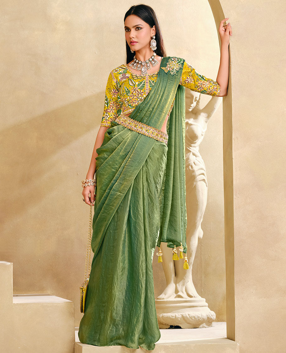Cardamom Green Plain Party Wear Designer Saree, Complemented with a Contrast Round Neck Heavy Embroidered 3/4th Sleeve Readymade Blouse, Detachable Embroidered Belt, and a Free Embroidered Flap Sling Bag
