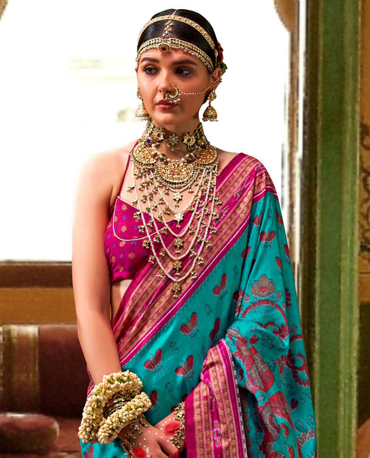 Blue ikkat floral buttas woven designer catalog saree, contrast ikkat rudraksha border, and pallu of ikkat weave