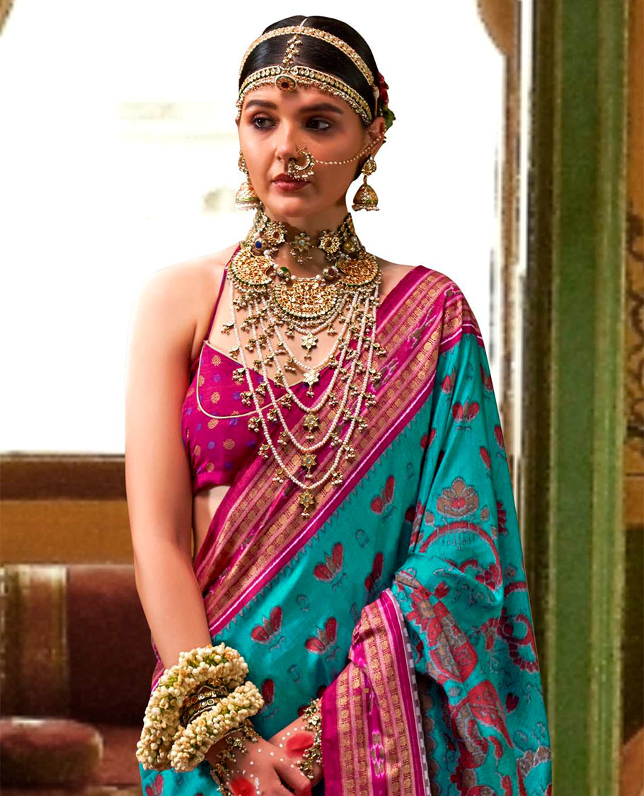 Blue ikkat floral buttas woven designer catalog saree, contrast ikkat rudraksha border, and pallu of ikkat weave