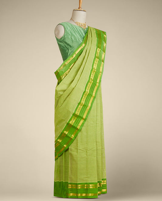 Light green micro-checked gadwal saree, contrast traditional design zari border & pallu of zari stripes