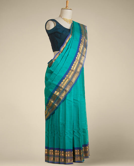 Green striped gadwal silksaree, contrast border of traditional zari designs & zari-enriched pallu