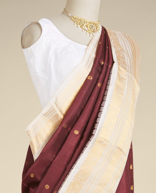 Maroon gadwal silk saree with zari buttas, contrast vidarbha zari border & pallu featuring peacock & intricate designs